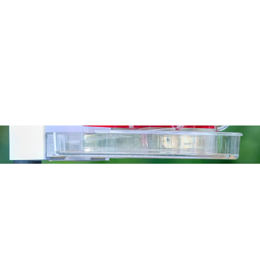 Close-up of the clear base tray for Trail Optics Smart Hummingbird Feeder with drainage holes.